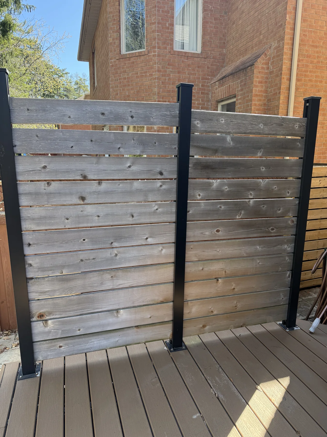 Before horizontal fence staining by Bright Home Care in the GTA